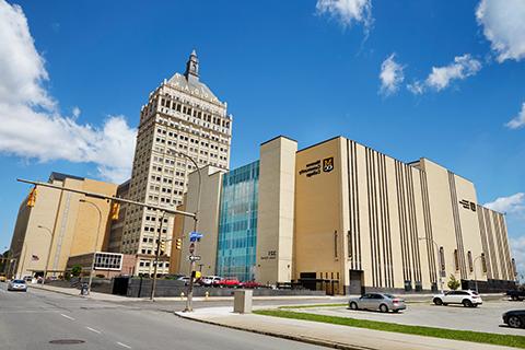 Exterior view of the Downtown campus building, with the Kodak building in the background